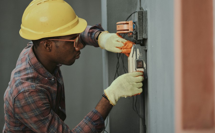 Electrician testing an electrical panel